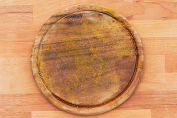 A kitchen board with the remnants of spices.