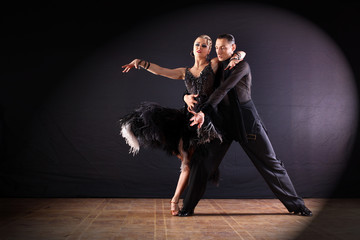 dancers in ballroom isolated on black background