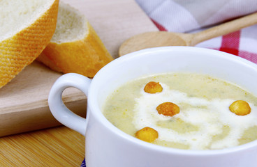 Squash Zucchini Potatoes and Carrot cream soup.
Vegetable soup in white bowl