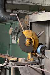 Electric saw for cutting iron. Saw for cutting iron in the factory