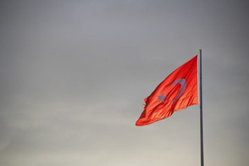 Turkish Flag with Cloudy Background on Sunset and Windy Day