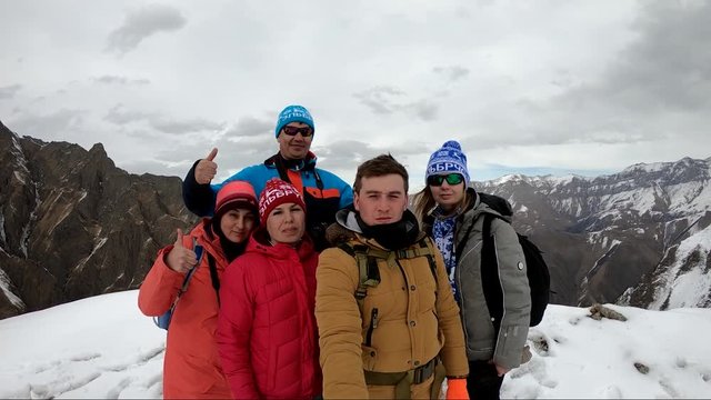 Tourist group makes selfi at the top of a mountain pass