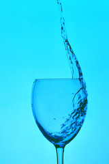 glass of water on a dark blue background