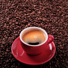 Red coffee cup filled full espresso americano black with background various dark roasted beans scattered flat lay square format photo
