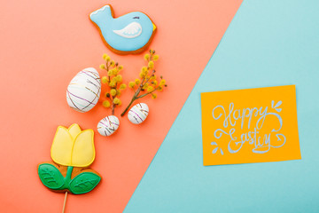 Easter biscuits, eggs and pussy willow. Happy Easter colorful background. Wishing happy Easter.