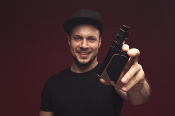 Vaping man and a cloud of vapor