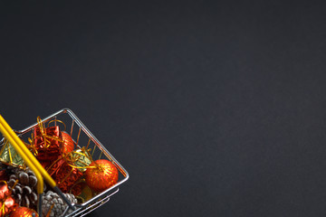 basket with gifts, deer, stars and fir-trees, flat lay on a dark blue background, holiday greetings