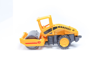 Obraz na płótnie Canvas Toy construction vehicles Excavator industrial machine doing construction new road earthworks on white background