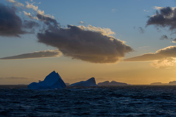 Naklejka na ściany i meble Iceberg at sunset