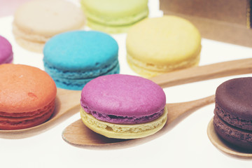 Colorful macarons on white background. Macaron is sweet meringue-based confection.