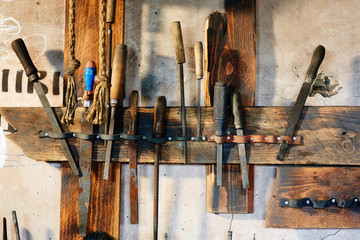 Old tools on the workbench in the workshop