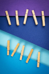 pins attached to blue and purple paper