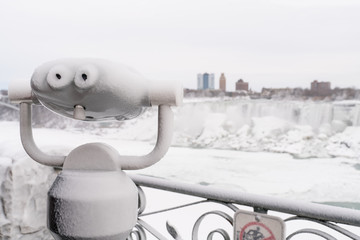Binoculars looking at Niagara Falls in winter