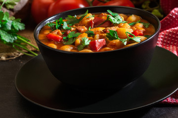 White bean soup with potatoes, tomatoes, paprika, and bacon