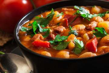 White bean soup with potatoes, tomatoes, paprika, and bacon