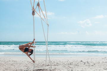 Fototapeta na wymiar Pole dancer on the beach
