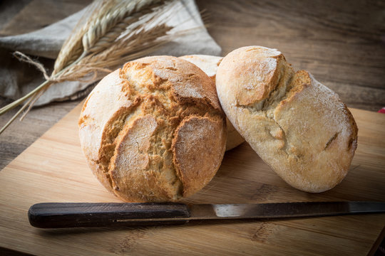 Roll breads on cutting board.