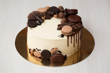 Chocolate cake for men with chocolate decorations and the streaks of chocolate