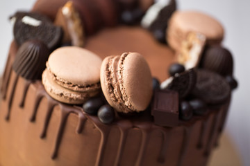 Chocolate cake for men with chocolate decorations and the streaks of chocolate
