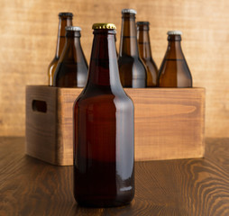 Craft beer bottles on wooden table