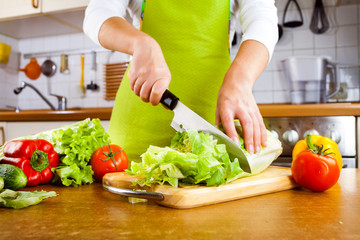 Woman's hands cutting vegetables