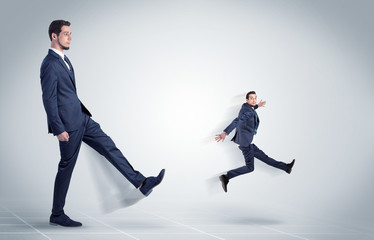 Young businessman fired cruel and aggressive by his boss with white background
