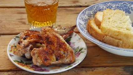 Delicious chicken wings on the coals.
