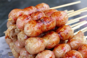 Deep fried sausages of fermented pork and glutinous rice northeastern Sai Krok Isaan Thai food