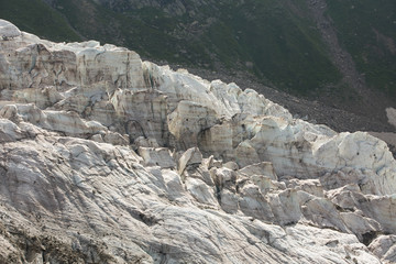 Aerial view of show and ice of Kashkatash Glacier on the west Caucasian mountains in Russia.