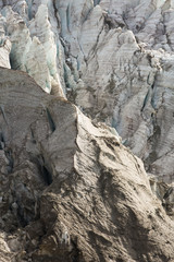 Aerial view of show and ice of Kashkatash Glacier on the west Caucasian mountains in Russia.