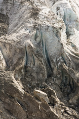 Aerial view of show and ice of Kashkatash Glacier on the west Caucasian mountains in Russia.