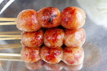 Deep fried sausages of fermented pork and glutinous rice northeastern Sai Krok Isaan Thai food