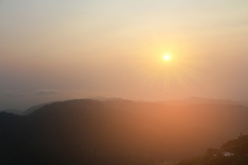 Beautiful sunset landscape on green mountain  