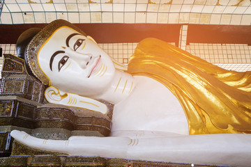 Obraz na płótnie Canvas Shwethalyaung Buddha Big Reclining Buddha Buddhist Temple in Bago Myanmar