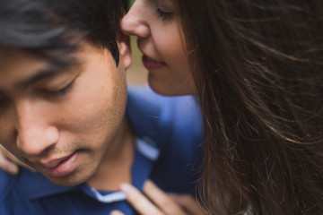 bride and groom newlyweds kissing in woods on green background Wedding Day