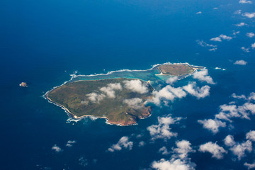 Top view aerial photo, tropical island in open sea