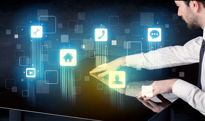 Modern smart table with high tech icons on its interface screen concept