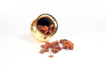 Star anise spice in shiny metal pot
