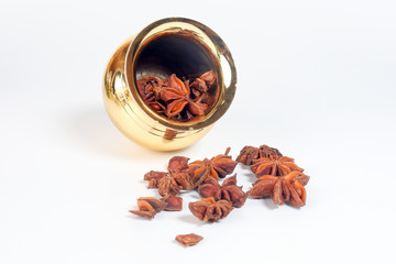 Star anise spice in shiny metal pot