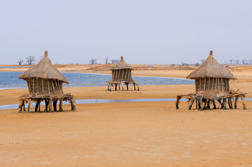 Granaries on stilts out in the sea to protect from fire, Joal , Senegal 
