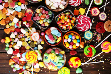 candies with jelly and sugar. colorful array of different childs sweets and treats.