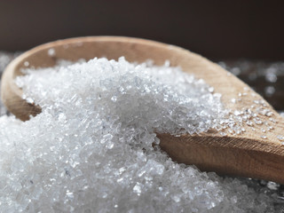 Sugar on a spoon close-up, macro photo.