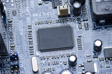 Fototapeta premium Printed circuit Board with parts and microchip close-up