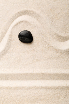 Zen sand and stone garden with raked lines and curves. Simplicity, concentration or calmness abstract concept