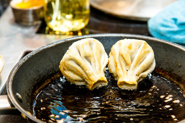Traditional Georgian khinkali fried in a pan