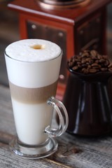 Delicious fresh latte coffee on wooden table