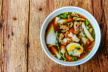 Rice Noodle Soup with pork spare ribs on wooden background