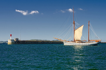 Sailing ship in the blue sea under sail. Yachting. Sailing