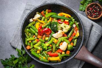 Stir fry vegetables in the wok. Vegetarian food.
