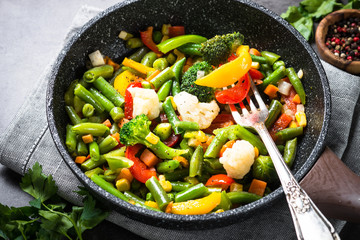 Stir fry vegetables in the wok. Vegan food.